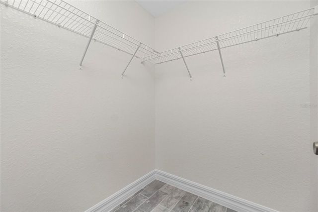 8270 Cook Ct, Port Charlotte, FL 33981 - walk in closet featuring wood finished floors