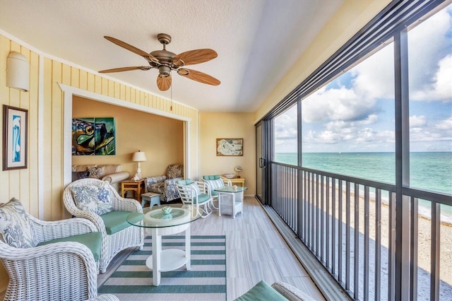 2700 N Beach Rd Unit B205, Englewood, FL 34223 - sunroom with view of water and beach and a ceiling fan