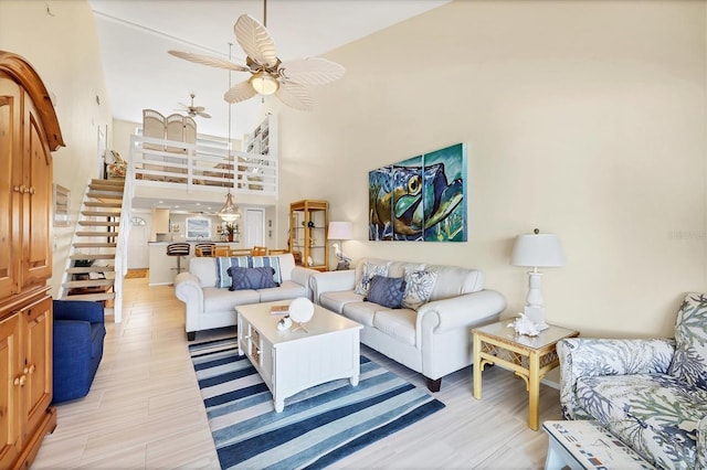 2700 N Beach Rd Unit B205, Englewood, FL 34223 - living room with a ceiling fan, a high ceiling, and stairs