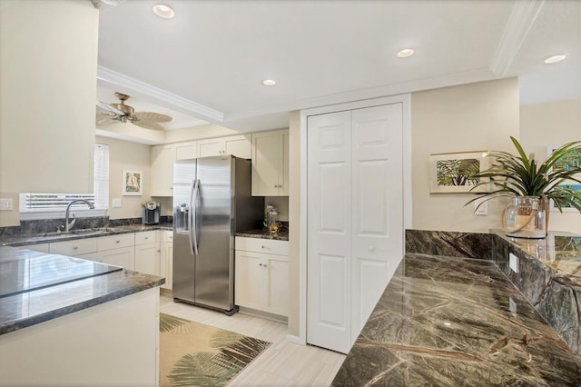 2700 N Beach Rd Unit B205, Englewood, FL 34223 - kitchen featuring stainless steel fridge, a sink, recessed lighting, dark stone counters, and ornamental molding