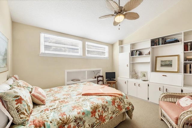 2700 N Beach Rd Unit B205, Englewood, FL 34223 - bedroom with light carpet, lofted ceiling, a ceiling fan, and a textured ceiling