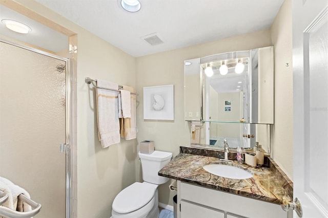 2700 N Beach Rd Unit B205, Englewood, FL 34223 - full bathroom with vanity, a stall shower, and toilet
