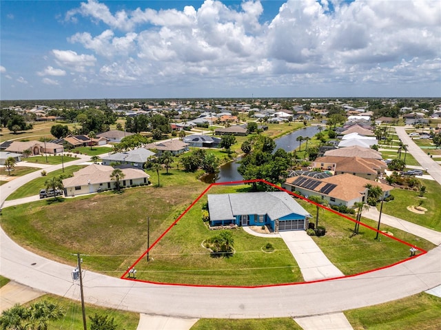 23 Bunker Cir, Rotonda West, FL 33947 - aerial view of residential area featuring a large body of water and property boundaries highlighted