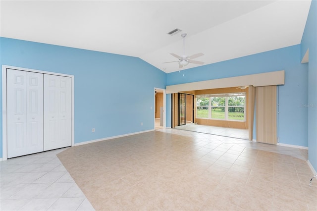 23 Bunker Cir, Rotonda West, FL 33947 - unfurnished bedroom with light tile patterned flooring, lofted ceiling, baseboards, and a ceiling fan