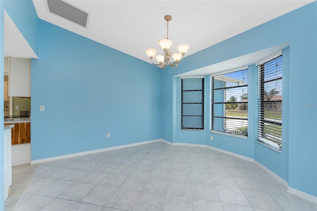 23 Bunker Cir, Rotonda West, FL 33947 - empty room featuring a chandelier and baseboards