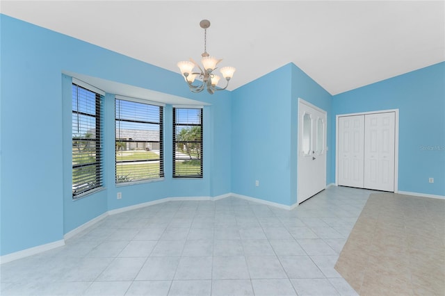 23 Bunker Cir, Rotonda West, FL 33947 - unfurnished room with a chandelier, vaulted ceiling, baseboards, and light tile patterned flooring