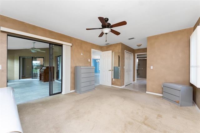 23 Bunker Cir, Rotonda West, FL 33947 - unfurnished bedroom featuring carpet flooring, baseboards, and a ceiling fan