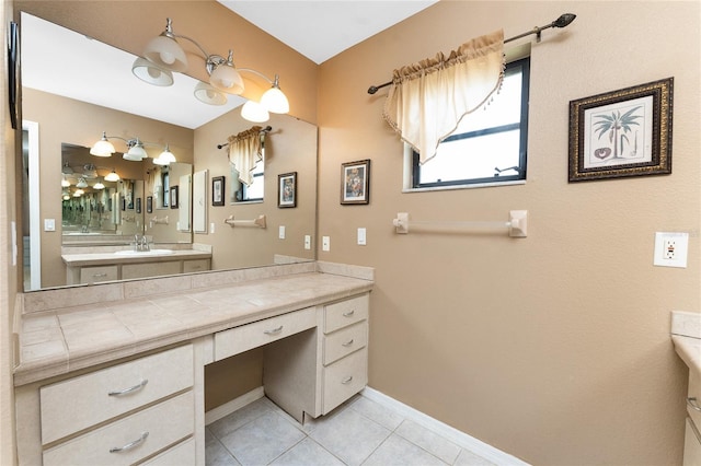 23 Bunker Cir, Rotonda West, FL 33947 - bathroom with vanity, tile patterned flooring, and baseboards