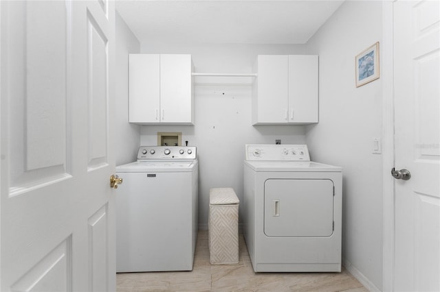 23 Bunker Cir, Rotonda West, FL 33947 - washroom with cabinet space and washing machine and clothes dryer