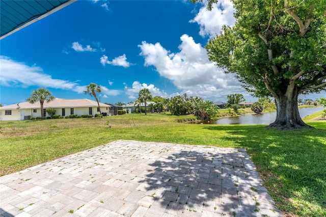 23 Bunker Cir, Rotonda West, FL 33947 - view of patio / terrace featuring a water view