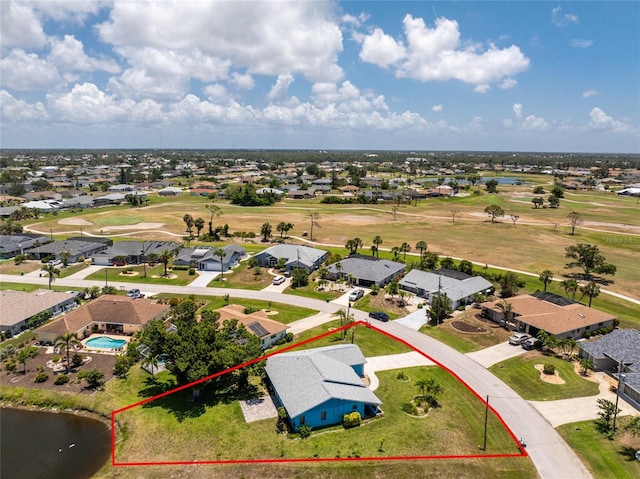 23 Bunker Cir, Rotonda West, FL 33947 - aerial view of residential area featuring property parcel outlined, a nearby body of water, and a golf club