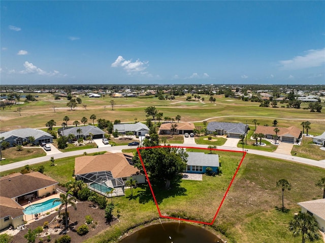 23 Bunker Cir, Rotonda West, FL 33947 - aerial view of residential area with property parcel outlined, a golf course, a pool area, and a nearby body of water