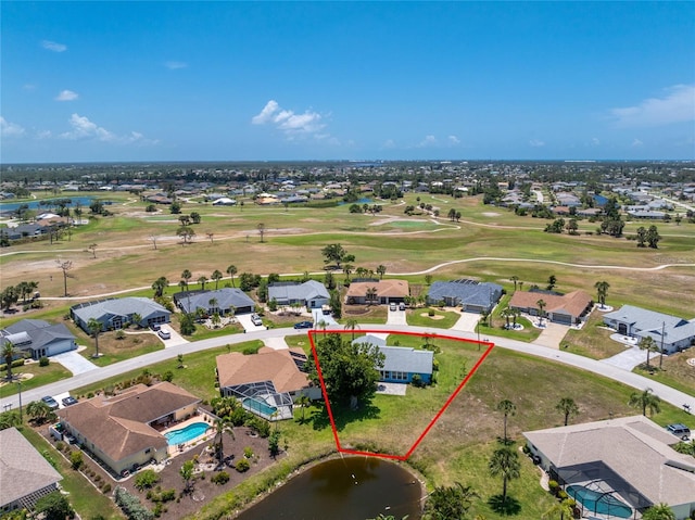 23 Bunker Cir, Rotonda West, FL 33947 - aerial perspective of suburban area with a nearby body of water, property boundaries highlighted, a golf course, and a pool area