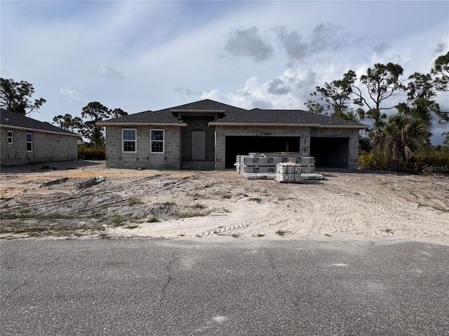 14 Current Ln, Placida, FL 33946 - view of front of property with an attached garage and dirt driveway