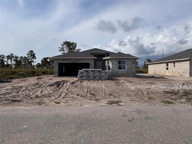 12 Current Ln, Placida, FL 33946 - view of front facade with a garage and dirt driveway