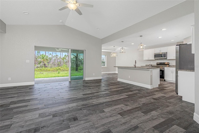 12 Current Ln, Placida, FL 33946 - unfurnished living room featuring ceiling fan, baseboards, dark wood-style flooring, recessed lighting, and high vaulted ceiling