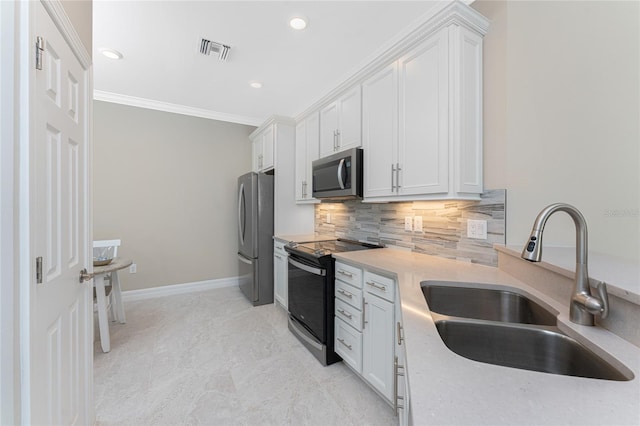 13859 Vadini St, Venice, FL 34293 - kitchen featuring appliances with stainless steel finishes, a sink, light countertops, white cabinets, and crown molding