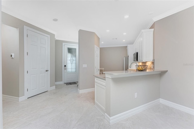 13859 Vadini St, Venice, FL 34293 - kitchen featuring stainless steel appliances, white cabinets, recessed lighting, light countertops, and baseboards