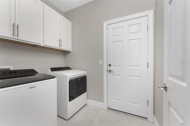 13859 Vadini St, Venice, FL 34293 - laundry room with washing machine and clothes dryer, cabinet space, and baseboards