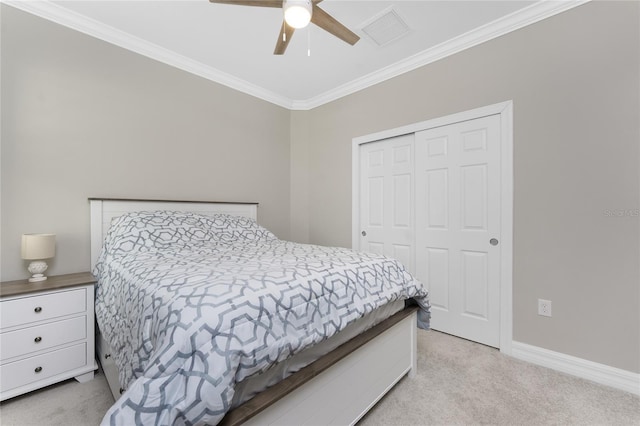 13859 Vadini St, Venice, FL 34293 - bedroom featuring light carpet, crown molding, a closet, baseboards, and a ceiling fan