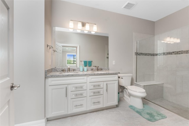 13859 Vadini St, Venice, FL 34293 - full bathroom featuring toilet, double vanity, walk in shower, and tile patterned flooring