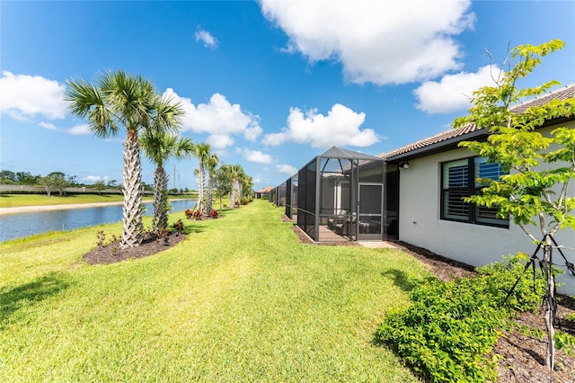 13859 Vadini St, Venice, FL 34293 - view of green lawn featuring a water view and glass enclosure
