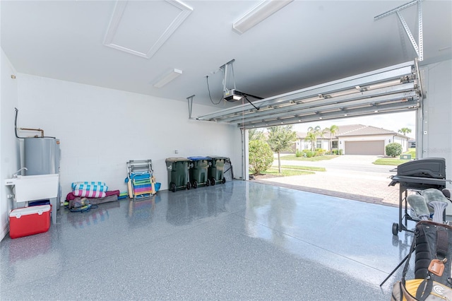 13859 Vadini St, Venice, FL 34293 - garage with water heater, a garage door opener, and concrete block wall