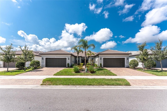 13859 Vadini St, Venice, FL 34293 - single story home with stucco siding, decorative driveway, and an attached garage