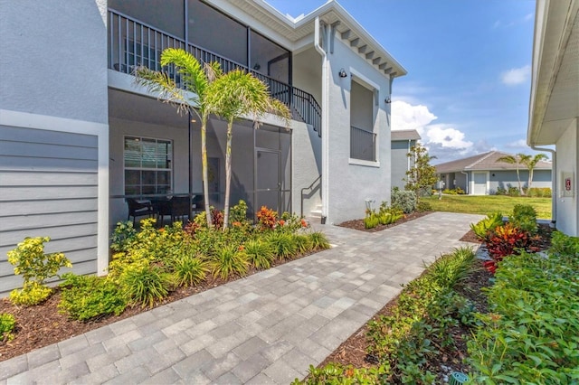 12470 Wellen Golf St Unit 108, Venice, FL 34293 - doorway to property featuring stucco siding