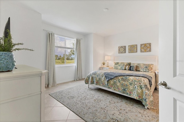 12470 Wellen Golf St Unit 108, Venice, FL 34293 - bedroom featuring light tile patterned floors and baseboards
