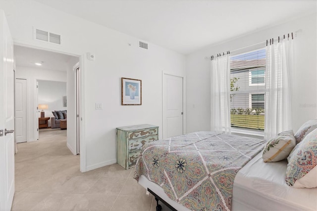 12470 Wellen Golf St Unit 108, Venice, FL 34293 - bedroom featuring light tile patterned floors and baseboards