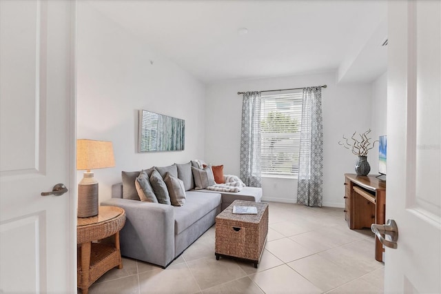 12470 Wellen Golf St Unit 108, Venice, FL 34293 - living room featuring light tile patterned floors and baseboards