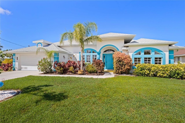116 Tournament Rd, Rotonda West, FL 33947 - mediterranean / spanish-style home with a front lawn, a garage, stucco siding, and concrete driveway