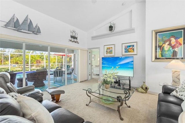 116 Tournament Rd, Rotonda West, FL 33947 - living room with carpet floors and high vaulted ceiling