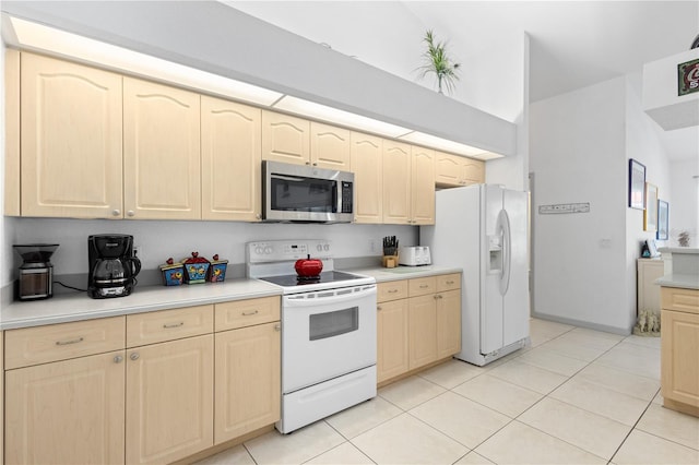 116 Tournament Rd, Rotonda West, FL 33947 - kitchen featuring white appliances, light brown cabinets, and light countertops