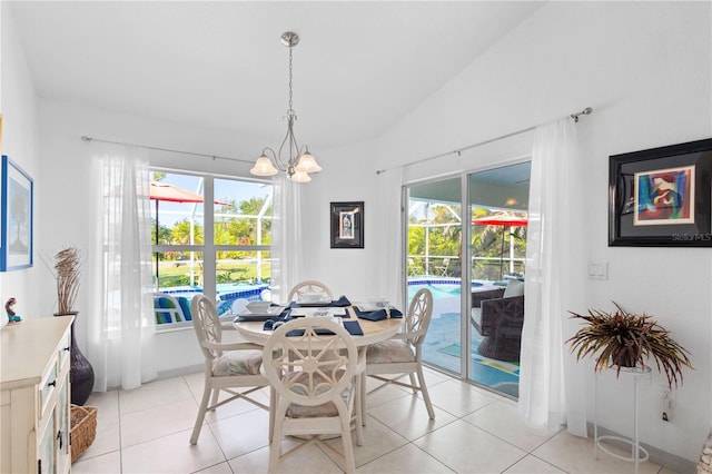 116 Tournament Rd, Rotonda West, FL 33947 - dining room with plenty of natural light, a chandelier, light tile patterned floors, and lofted ceiling