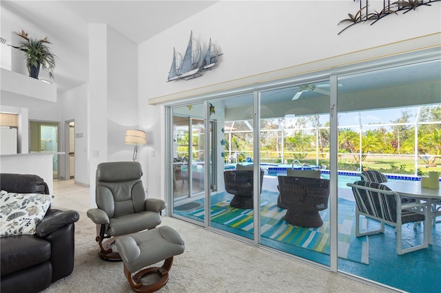 116 Tournament Rd, Rotonda West, FL 33947 - living area featuring ceiling fan, a sunroom, and light colored carpet