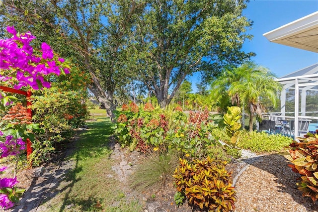 116 Tournament Rd, Rotonda West, FL 33947 - view of yard featuring glass enclosure