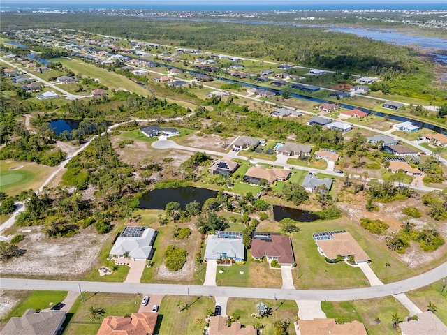 116 Tournament Rd, Rotonda West, FL 33947 - aerial overview of property's location featuring a large body of water and nearby suburban area