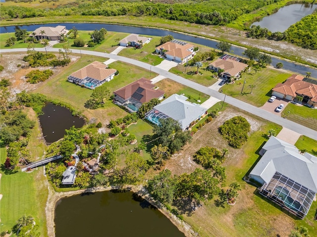 116 Tournament Rd, Rotonda West, FL 33947 - aerial view of property and surrounding area with a large body of water and nearby suburban area