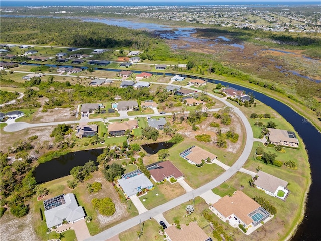 116 Tournament Rd, Rotonda West, FL 33947 - aerial overview of property's location with a large body of water and nearby suburban area
