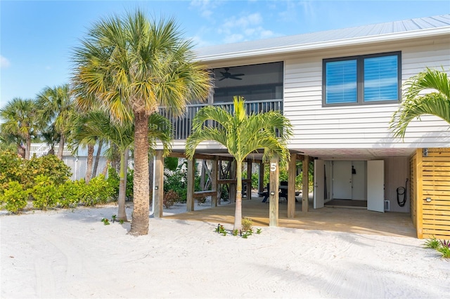 180 N Gulf Blvd Unit 5, Placida, FL 33946 - view of front of home with a carport, a ceiling fan, metal roof, and driveway