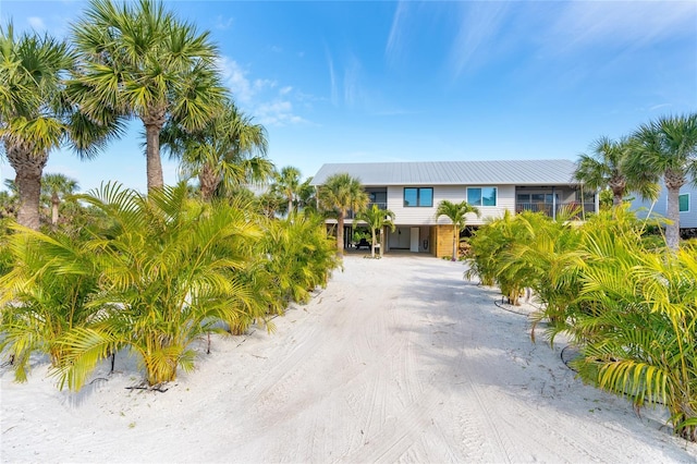 180 N Gulf Blvd Unit 5, Placida, FL 33946 - view of front facade with a carport, driveway, and metal roof