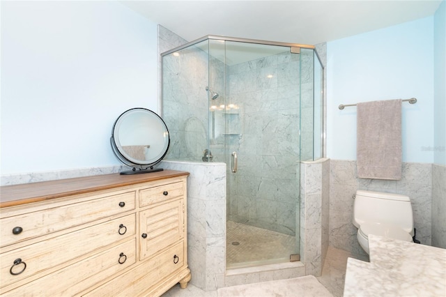 180 N Gulf Blvd Unit 5, Placida, FL 33946 - bathroom featuring vanity, toilet, a stall shower, and tile walls