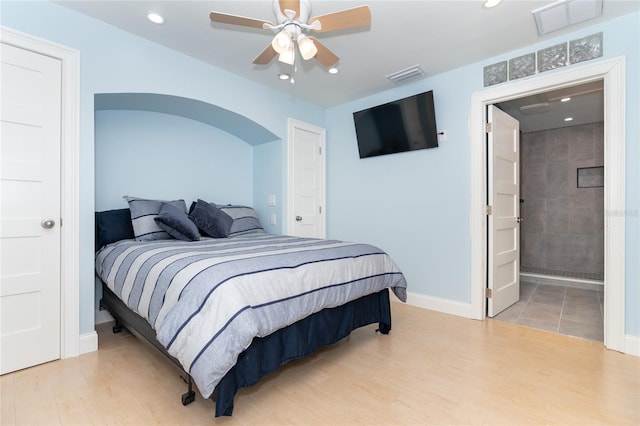 180 N Gulf Blvd Unit 5, Placida, FL 33946 - bedroom with wood finished floors, recessed lighting, baseboards, ceiling fan, and ensuite bathroom