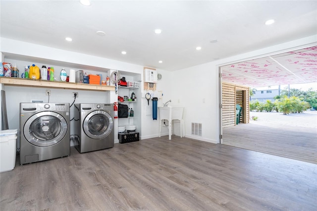 180 N Gulf Blvd Unit 5, Placida, FL 33946 - laundry room with washer and clothes dryer, wood finished floors, recessed lighting, and baseboards