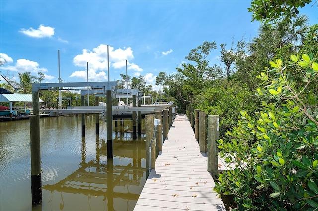 180 N Gulf Blvd Unit 5, Placida, FL 33946 - dock area featuring a water view and boat lift
