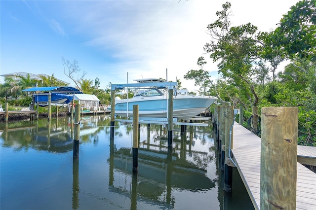 180 N Gulf Blvd Unit 5, Placida, FL 33946 - dock area featuring boat lift and a water view