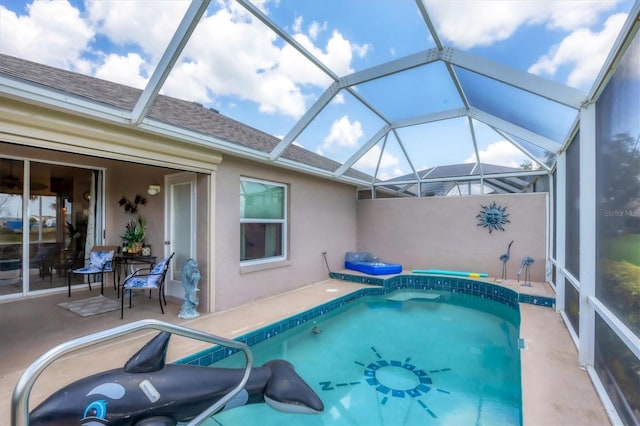4225 Fairway Dr, North Port, FL 34287 - swimming pool with a patio and glass enclosure