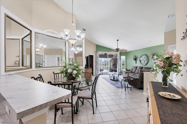 4225 Fairway Dr, North Port, FL 34287 - dining area featuring a chandelier, a ceiling fan, light tile patterned floors, and high vaulted ceiling